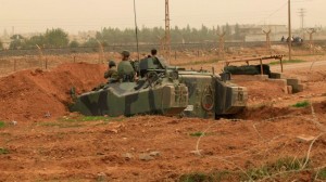 A Turkish army vehicle takes position at the border with Syria