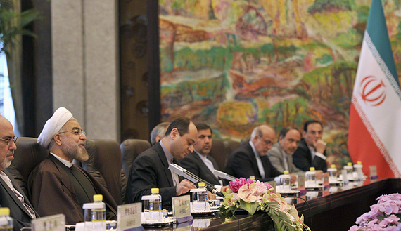 Iranian President Hassan Rouhani and Chinese President Xi Jinping attend a meeting at the Xijiao State Guesthouse in Shanghai