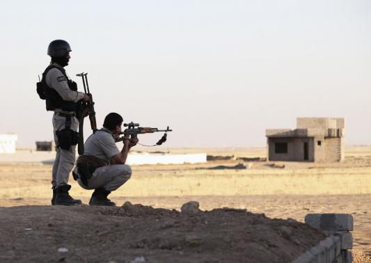 Kurdish Peshmerga troops participate in intensive security deployment against Islamic State militants in village on outskirts of the province of Nineveh near border province of Dohuk