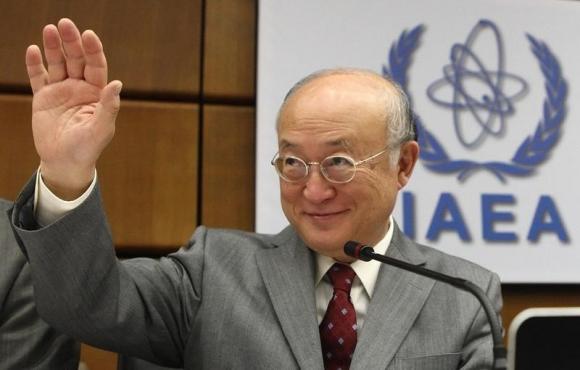 IAEA Director General Amano waves as he arrives for a board of governors meeting at the IAEA headquarters in Vienna