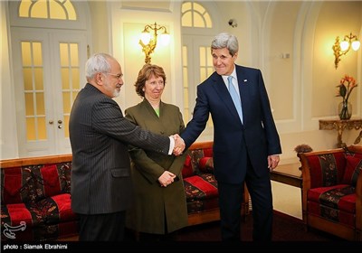 Iranian Foreign Minister Mohammad Javad Zarif, former EU Foreign Policy Chief Catherine Ashton and U.S. Secretary of State John Kerry pose for photographers at nuclear talks in Vienna on Thursday. AGENCE FRANCE-PRESSE/GETTY IMAGES