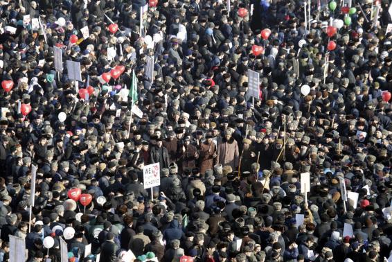 People attend a rally titled "Love for the Prophet Mohammad" to protest against satirical cartoons of the prophet, in Grozny, Chechnya