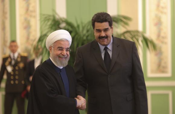 Venezuela's President Nicolas Maduro is welcomed by Iran's President Hassan Rouhani in Tehran