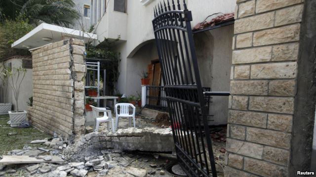 A general view of the damage caused by a bomb blast is seen at the gate of the Iranian ambassador's residence in Tripoli, Libya, Feb. 22, 2015.