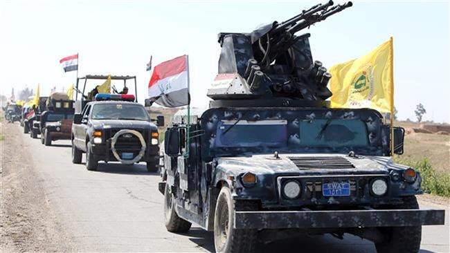 Members of the Iraqi security forces are heading from Samarra city to Tikrit to launch an assault against the ISIL militants on February 28, 2015. AFP