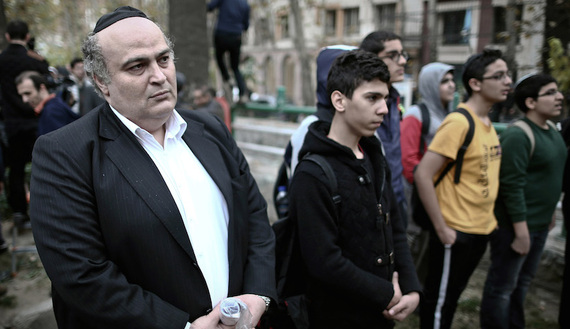 Iranian Jewish MP Siamak Moreh Sedgh (L) and schoolboys read prayers during a demonstration in front of the United Nations building in Tehran, Nov. 19, 2013. (photo by BEHROUZ MEHRI/AFP/Getty Images) Read more: http://www.al-monitor.com/pulse/originals/2015/03/iran-jewish-mp-netanyahu-congress-iran-letter.html#ixzz3UFmcMNYO