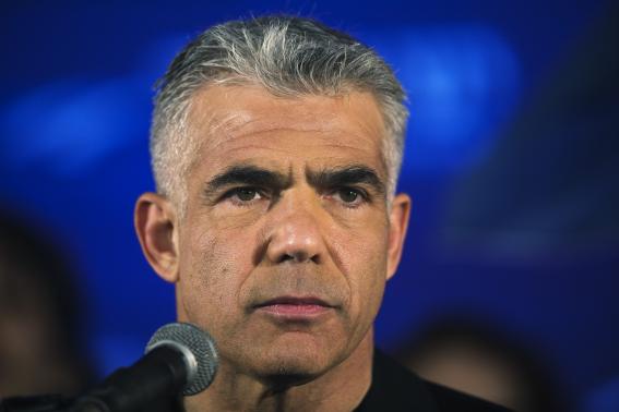 Yair Lapid, head of Yesh Atid party, speaks to supporters during a conference in Holon near Tel Aviv March 12, 2015. CREDIT: REUTERS/AMIR COHEN