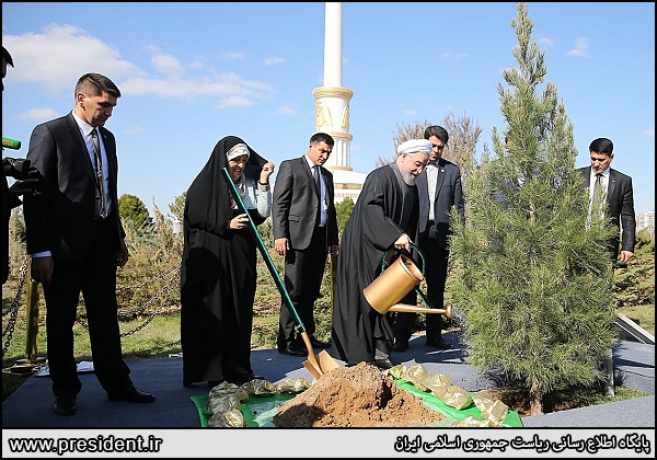 Iran's President Hassan Rouhani planted a sapling as a symbol of peace and friendship, in the Independence Park of Ashgabat on March 11, 2015.